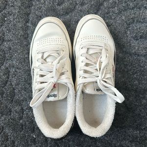 Reebok white/black sneakers, used in good condition.